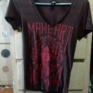 An obey shirt , that says make art not war..